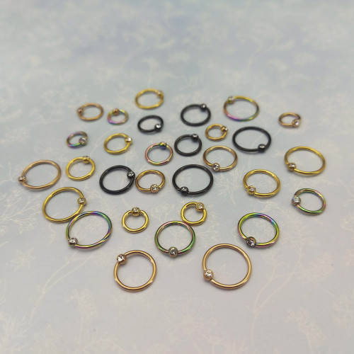 Кольцо 1,2 мм. Титан. Шарик с кристаллом, анодирование розовое золото. BCRTCA16rg