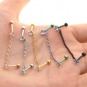 Штанга 1,2 мм для двух проколов. Цирконы в форме круга и звезды, титановое покрытие розовое золото. JC4701