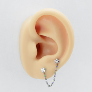 Штанга 1,2 мм для двух проколов. Цирконы в форме круга и звезды, титановое покрытие розовое золото. JC4701